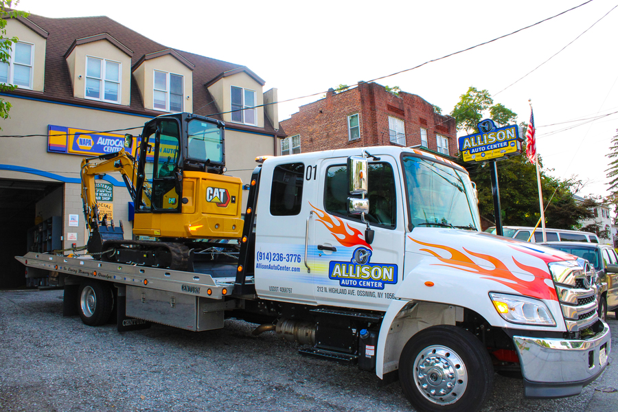 Allison Auto Center towing service team assisting a customer