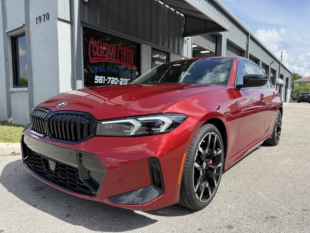 Red BMW sedan after collision repair